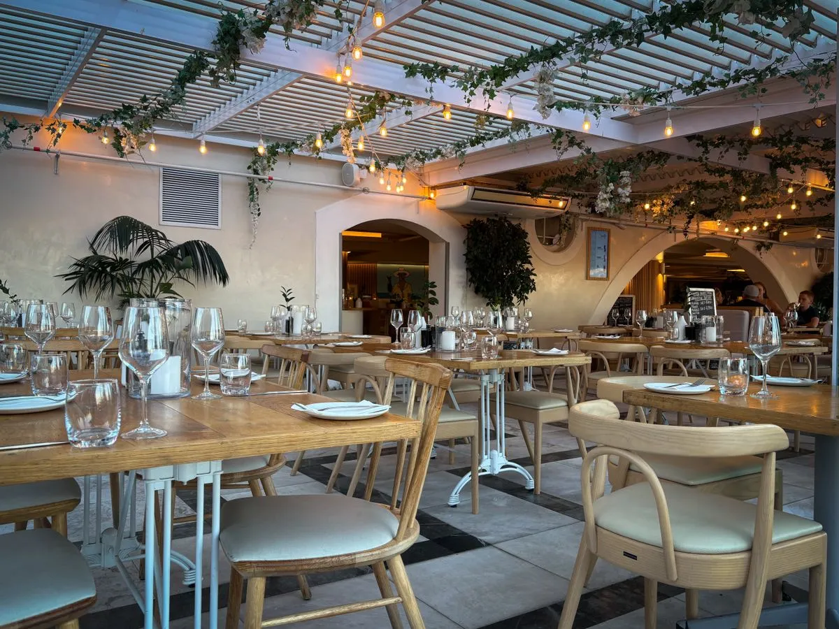 The warm, wood-paneled dining room at Harvest Table