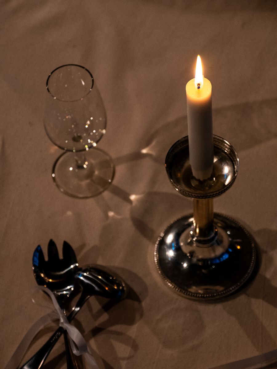Table detail: silver cutlery and wine glass
