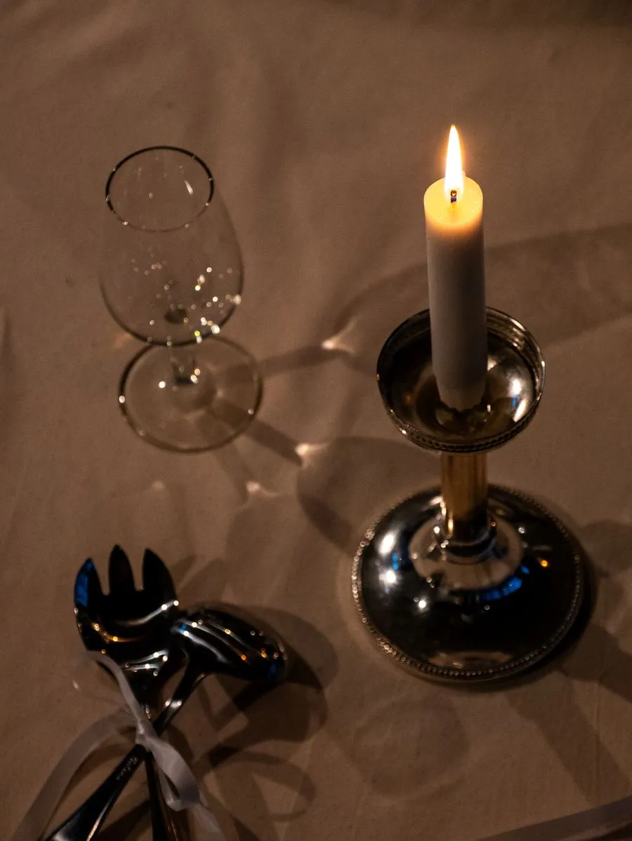 Table detail: silver cutlery and wine glass