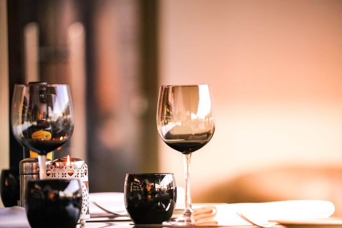 Wine glass and candle flame