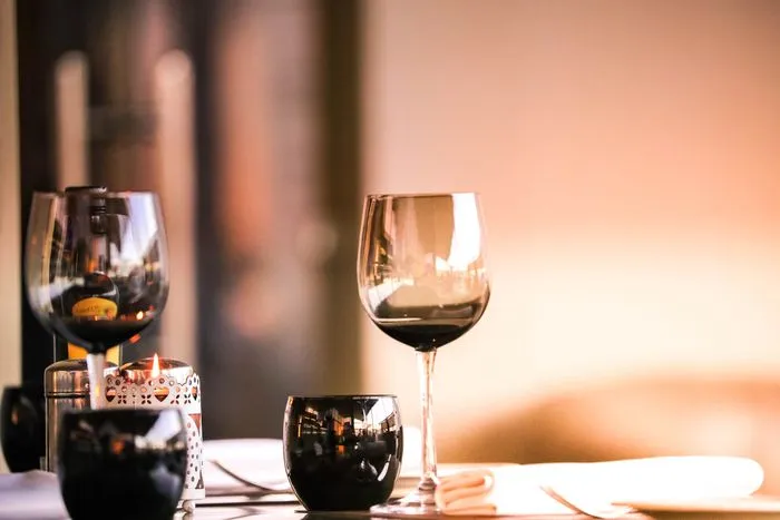 Wine glass and candle flame