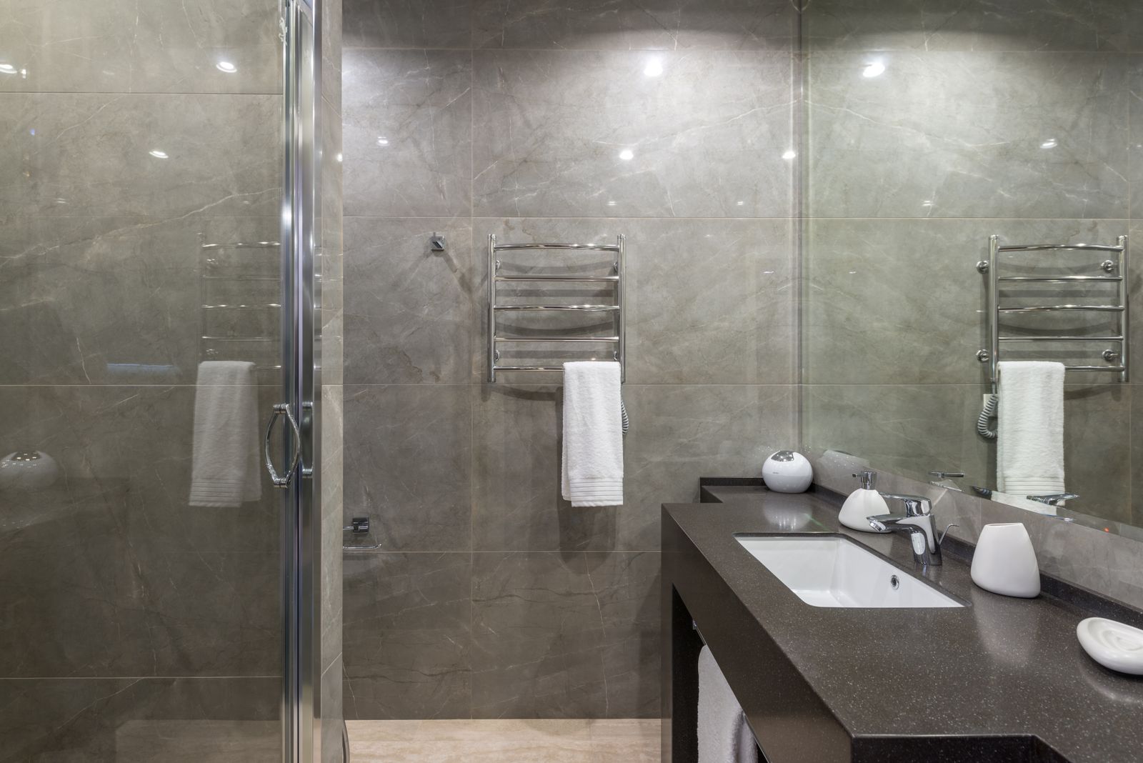 Walk-in glass shower with tile detail