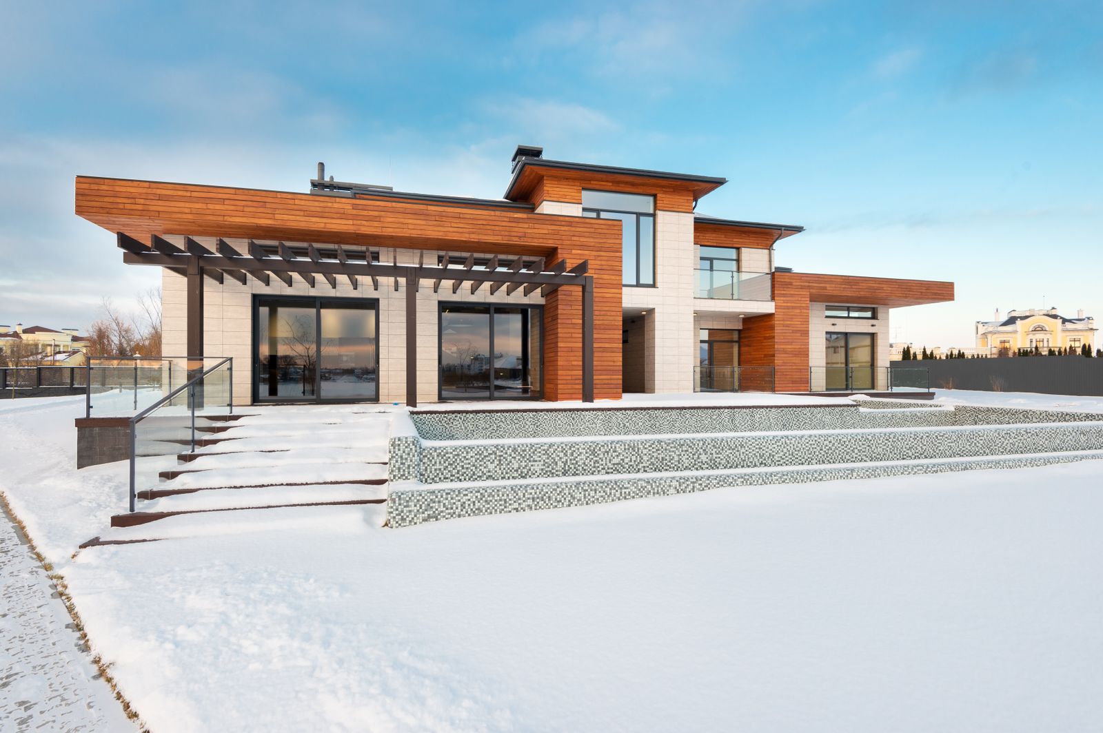 Two-story home exterior with a new upper-level addition