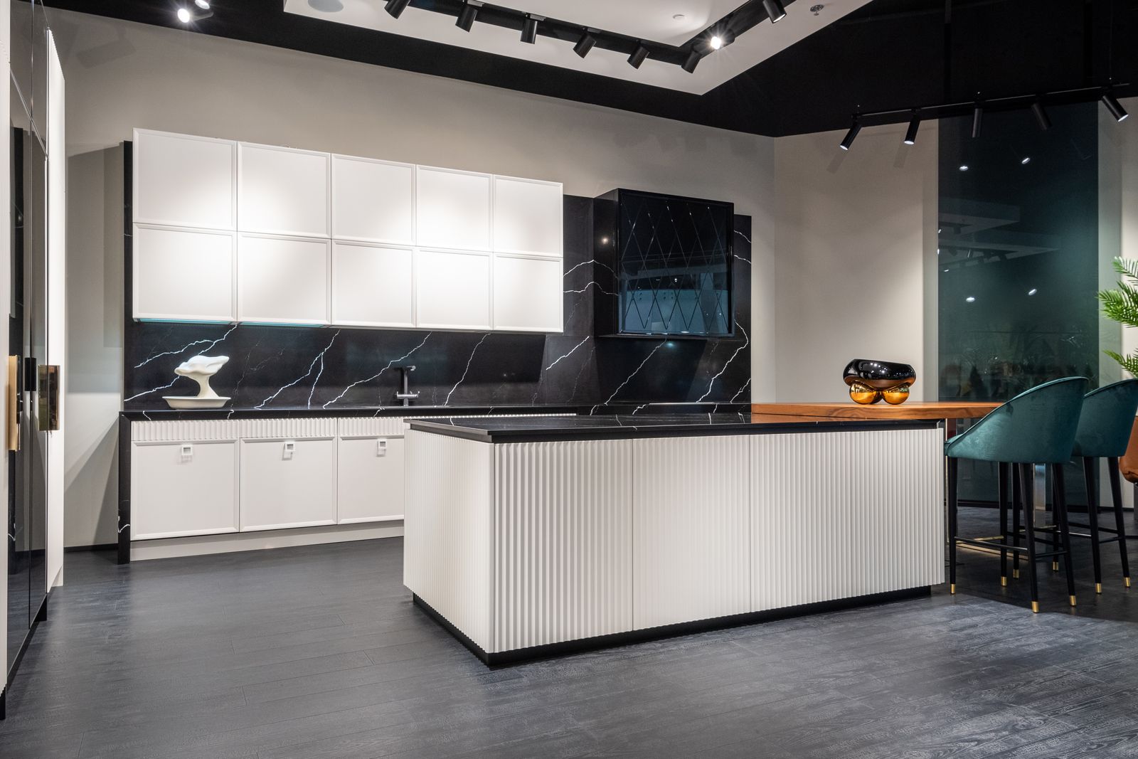 Renovated modern kitchen with a large island and marble backsplash