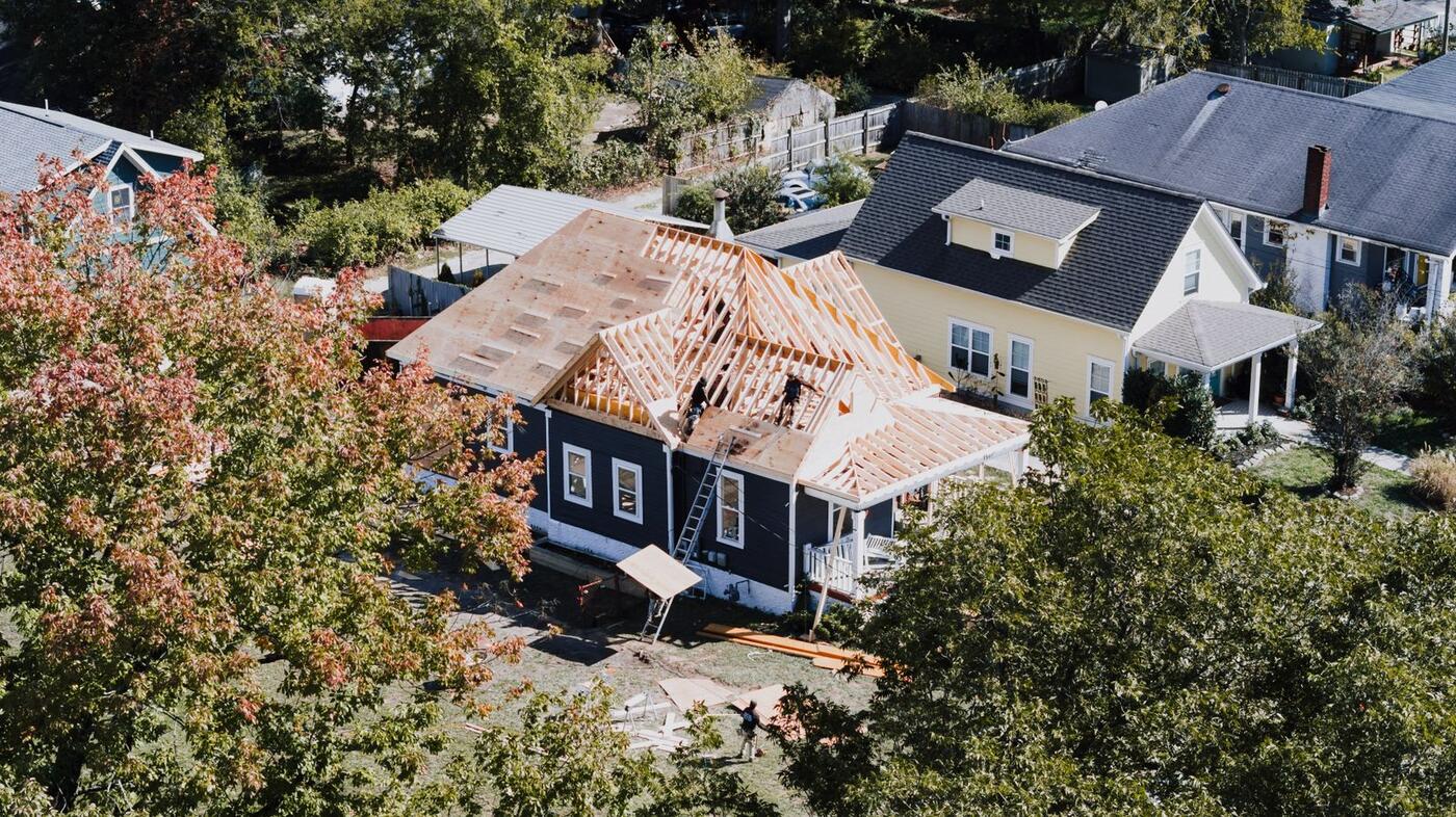 Aerial view of a new roofline tied into the existing home