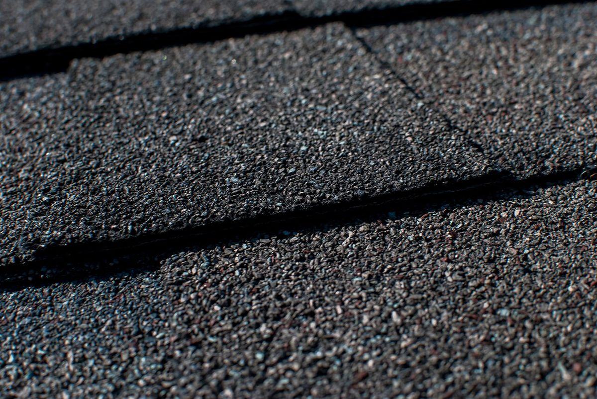 Close-up of new dark architectural asphalt shingles